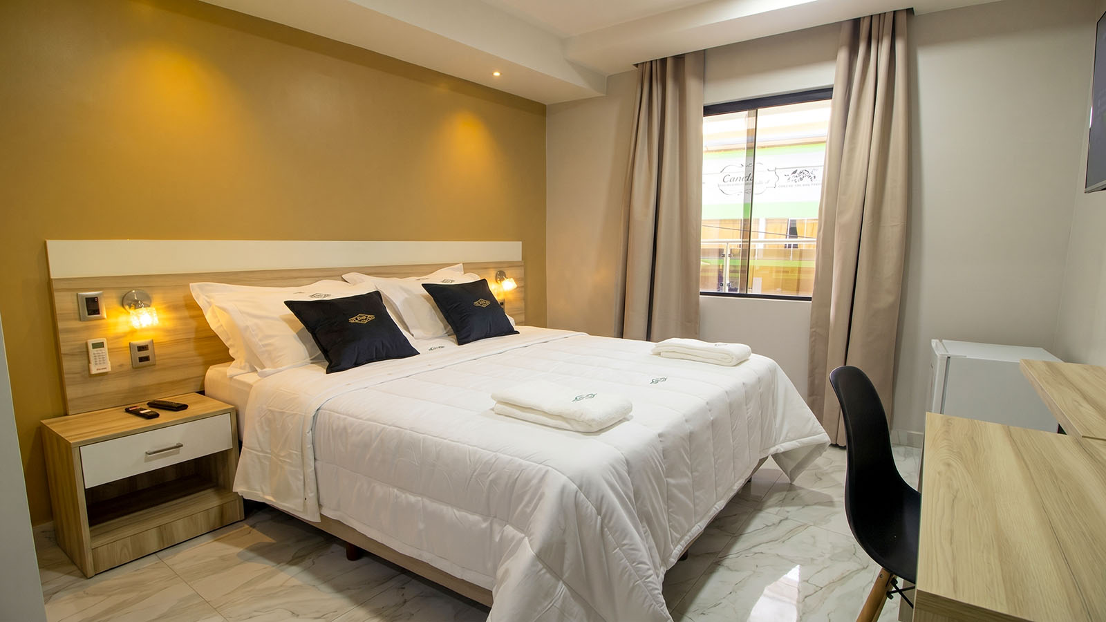 Room at Los Olivos Hotel prepared for a comfortable stay